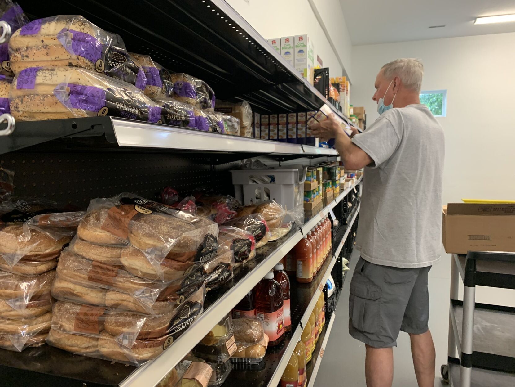 Workers restock shelves after break-in
